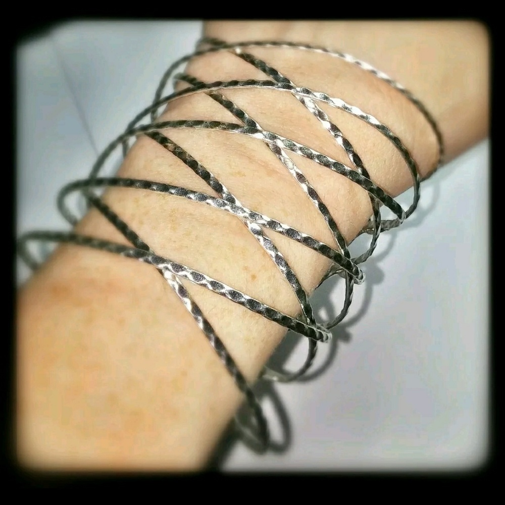 AVON MARK BURNISHED SILVERTONE CUFF BRACELET